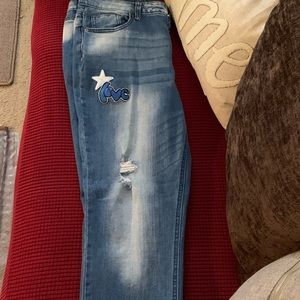 Vanilla star mid rise jeans with rips and patches